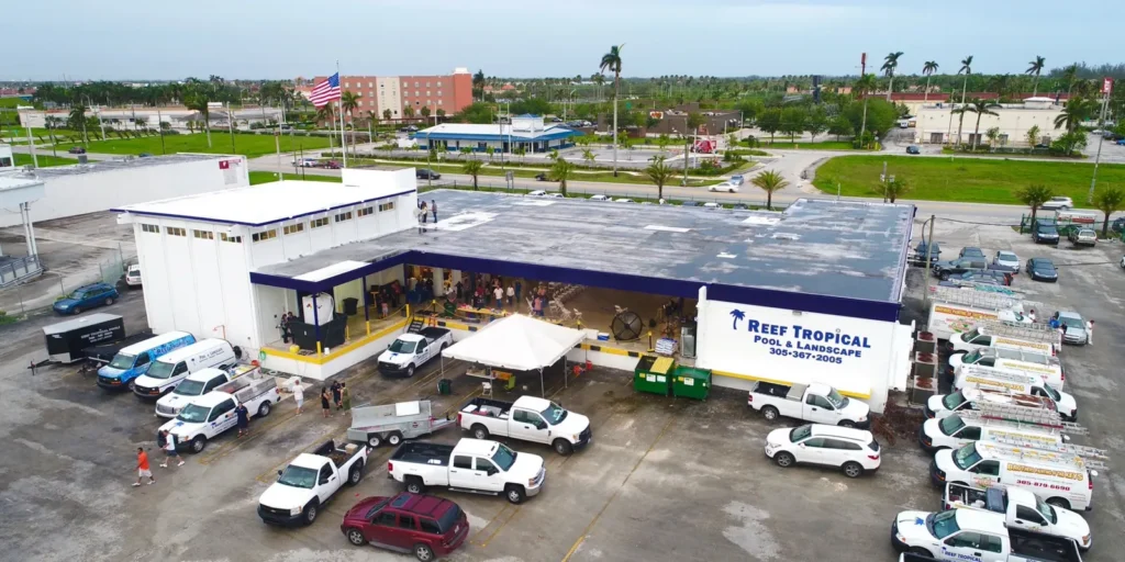 Aerial view of the Reef Tropical Pool and Landscape headquarters and service fleet in South Florida